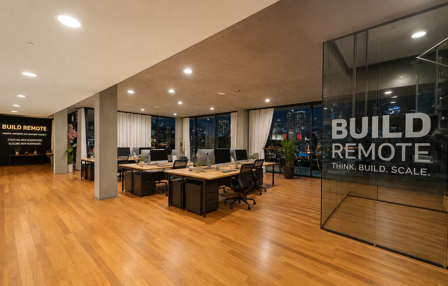 The Build Remote operations floor at dusk, desks and city view